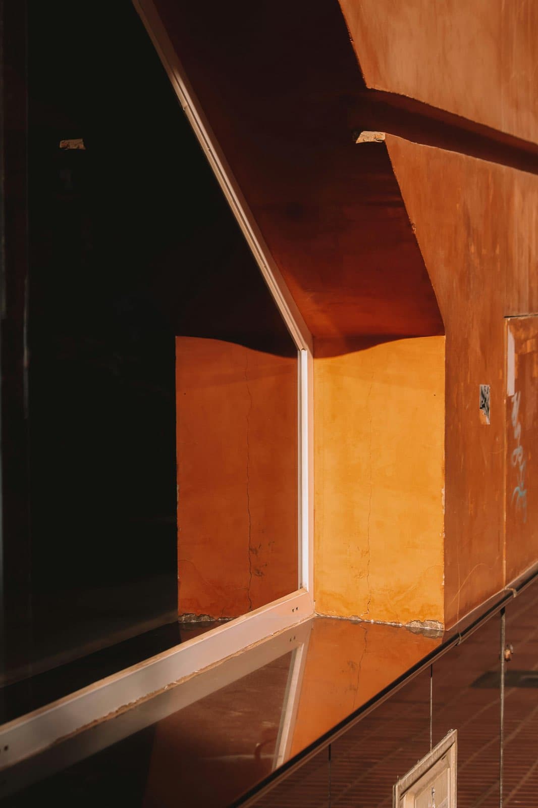 Warm architectural passage with clean lines and sculptural shadow